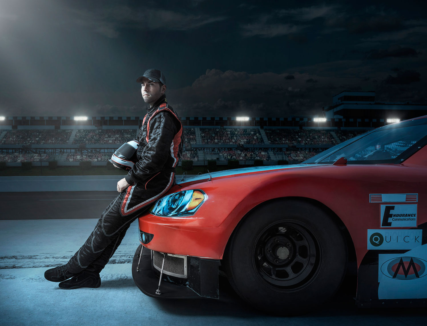 NASCAR Driver and Car Night Scene: CORBIS